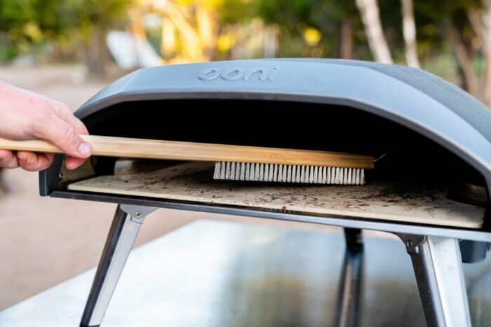 Lifestyle Ooni Pizza Oven Brush (Angled)1-min